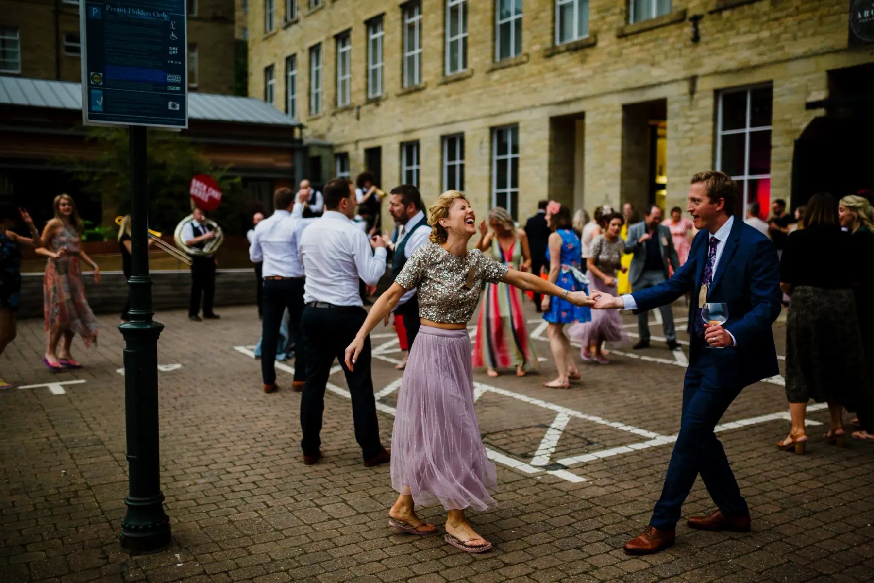 Guests celebrating outdoors in the Dean Clough courtyard