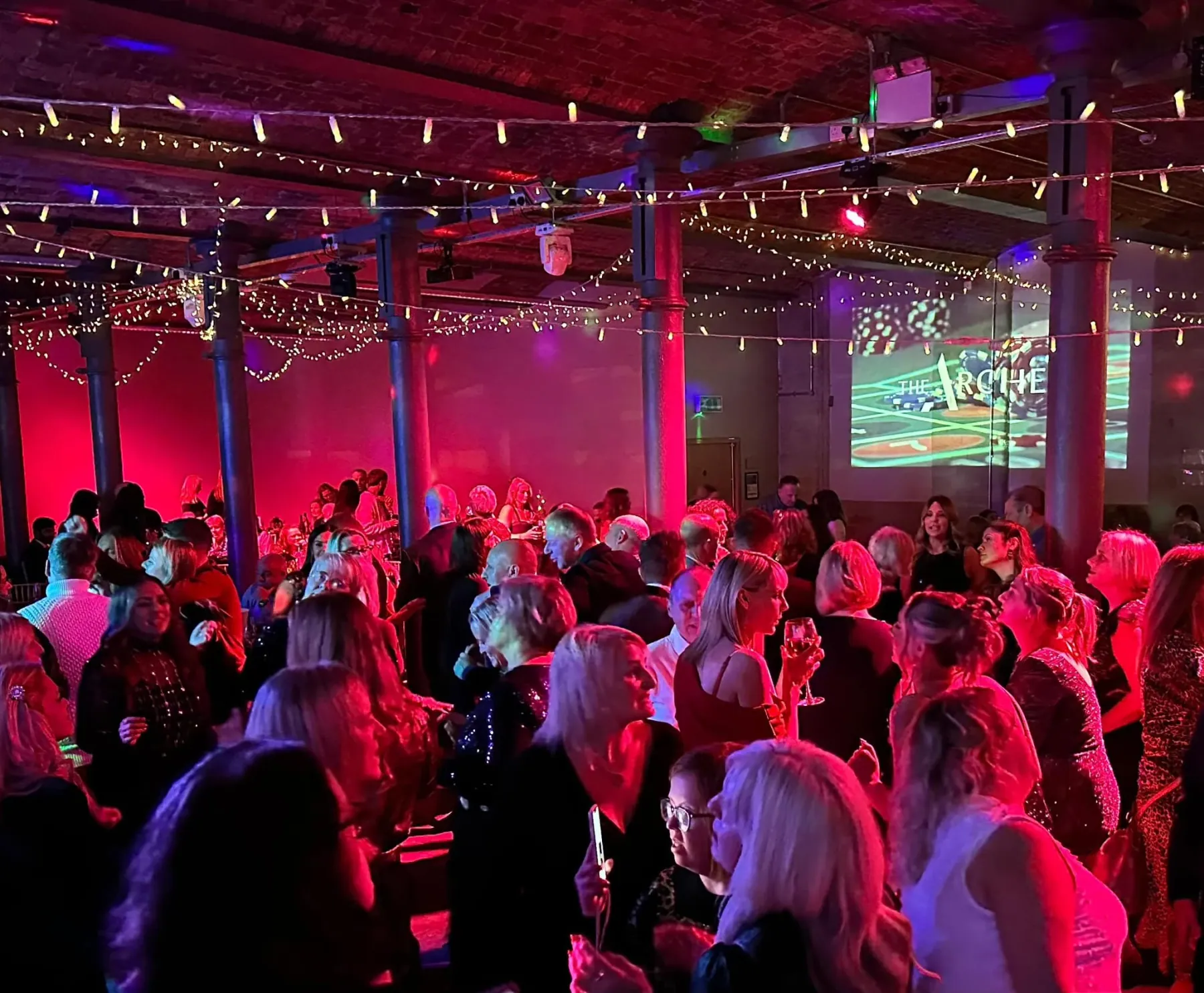 A packed dancefloor under the fairy lights at The Arches
