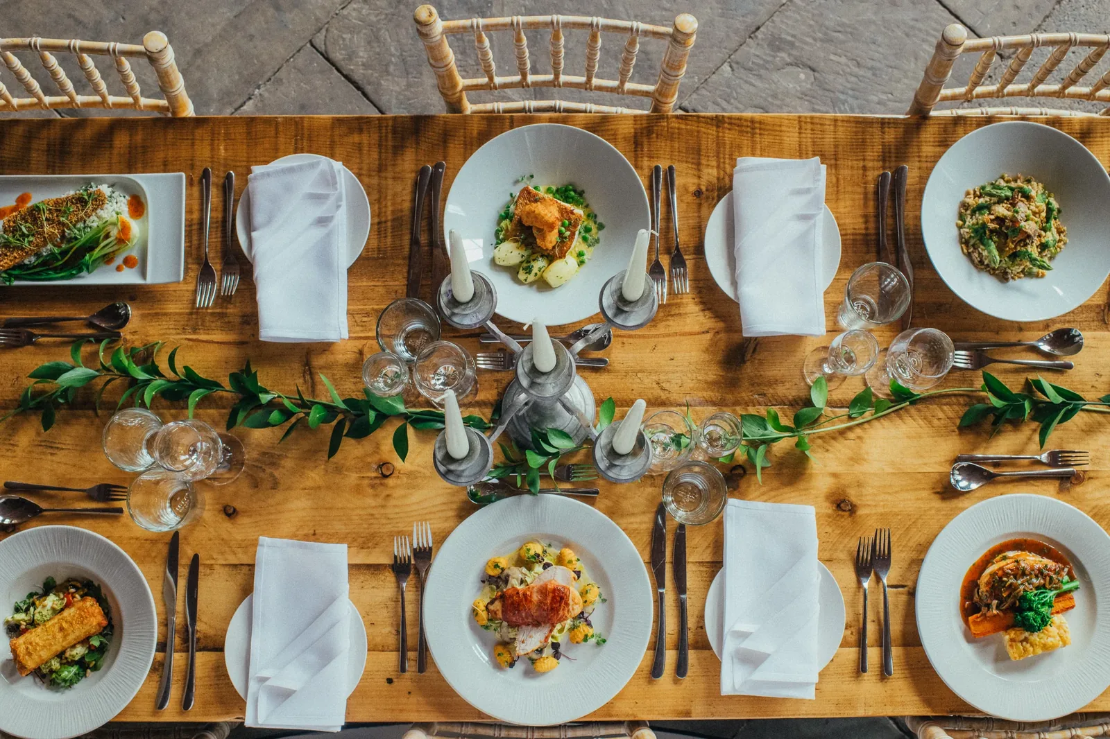 A table laid with plated dishes at The Arches